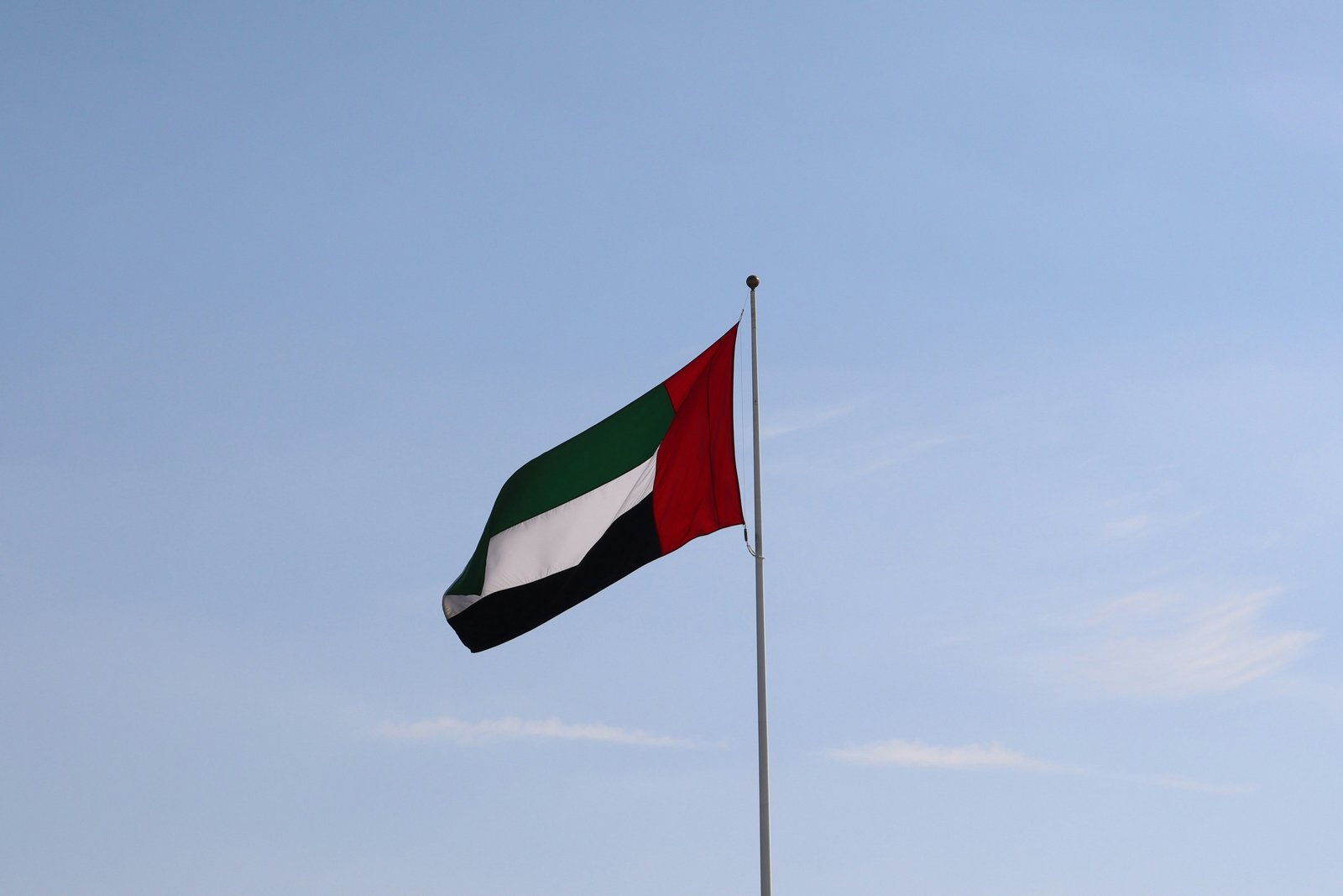 Passport and calendar with an OVERSTAY stamp: what happens if you overstay your UAE tourist visa
