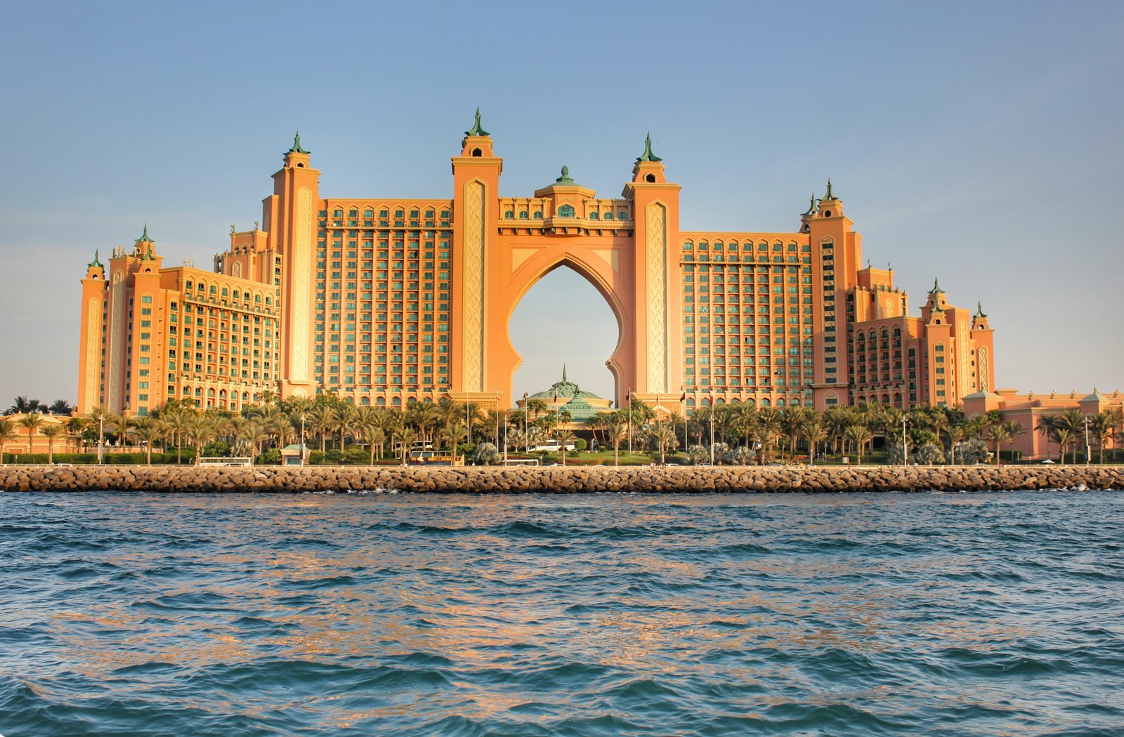 Dubai skyline at sunset with text: Extend your Dubai tourist visa without leaving the UAE